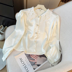 Hnewly Elegant Satin Spliced Lace Shirt Women French Style Summer 2025 Doll Collar Pearl Single Breasted Light Luxury Long Sleeve Tops